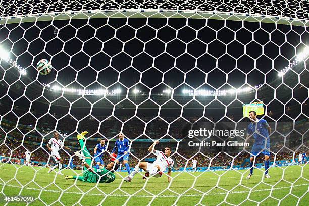 Sokratis Papastathopoulos of Greece scores his team's first goal past Keylor Navas of Costa Rica in stoppage time during the 2014 FIFA World Cup...