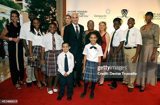 Former tennis player Andre Agassi and wife former tennis player Steffi Graf with Andre Agassi College Preparatory Academy students and faculty arrive...