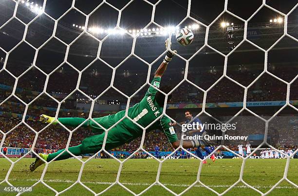 Theofanis Gekas of Greece has his penalty kick saved by Keylor Navas of Costa Rica during a shootout in the 2014 FIFA World Cup Brazil Round of 16...