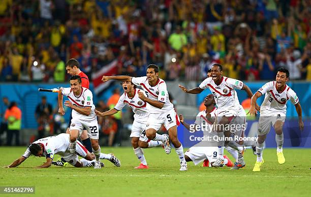 Costa Rica celebrate after defeating Greece in a penalty shootout during the 2014 FIFA World Cup Brazil Round of 16 match between Costa Rica and...