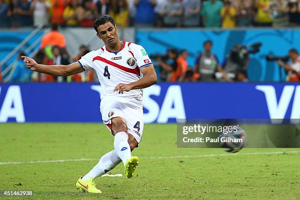 Michael Umana of Costa Rica shoots and scores a penalty kick to defeat Greece in a shootout during the 2014 FIFA World Cup Brazil Round of 16 match...
