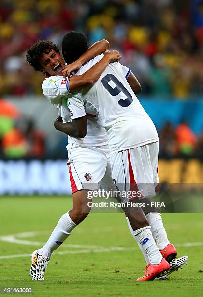 Yeltsin Tejeda and Joel Campbell of Costa Rica celebrate the win after the penalt shootout in the 2014 FIFA World Cup Brazil Round of 16 match...