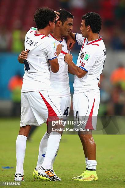 Yeltsin Tejeda, Michael Umana and Michael Barrantes of Costa Rica celebrate after defeating Greece in a penalty shootout during the 2014 FIFA World...