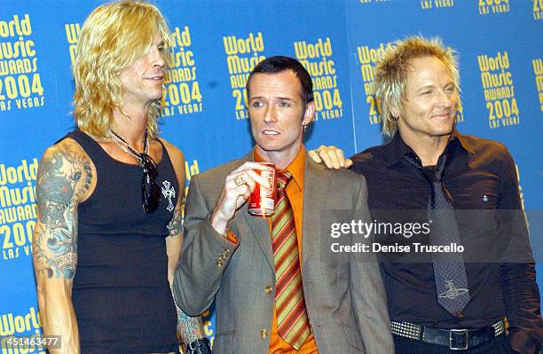 Matt Sorum, Duff McKagan and Scott Weiland of Velvet Revolver