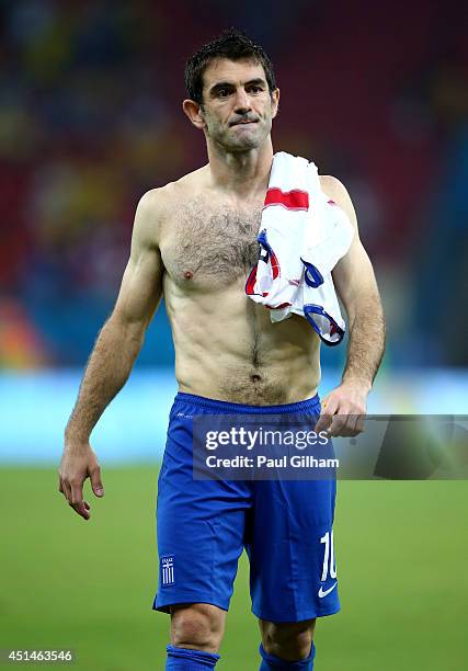 Giorgos Karagounis of Greece looks dejected after being defeated by Costa Rica in a penalty shootout during the 2014 FIFA World Cup Brazil Round of...