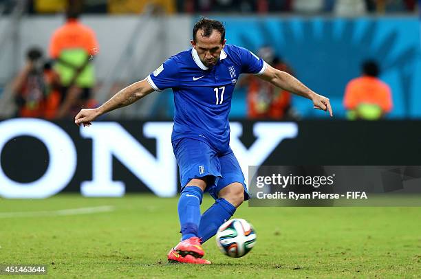 Theofanis Gekas of Greece takes his penalty kick in a penalty shootout during the 2014 FIFA World Cup Brazil Round of 16 match between Costa Rica and...