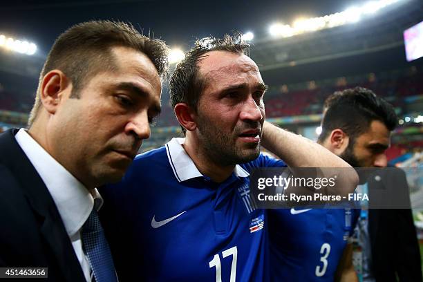 Theofanis Gekas of Greece walks off the pitch after the defeat in the 2014 FIFA World Cup Brazil Round of 16 match between Costa Rica and Greece at...