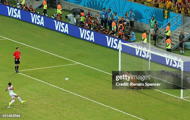 Michael Umana of Costa Rica shoots and scores his penalty kick past Orestis Karnezis of Greece to defeat Greece in a shootout during the 2014 FIFA...