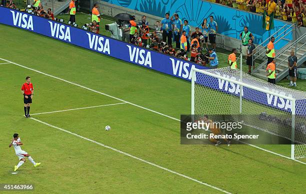 Michael Umana of Costa Rica shoots and scores his penalty kick past Orestis Karnezis of Greece to defeat Greece in a shootout during the 2014 FIFA...