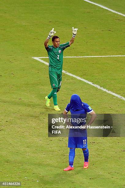 Keeper Keylor Navas of Costa Rica reacts after saving a penalty kick by Theofanis Gekas of Greece during the 2014 FIFA World Cup Brazil Round of 16...