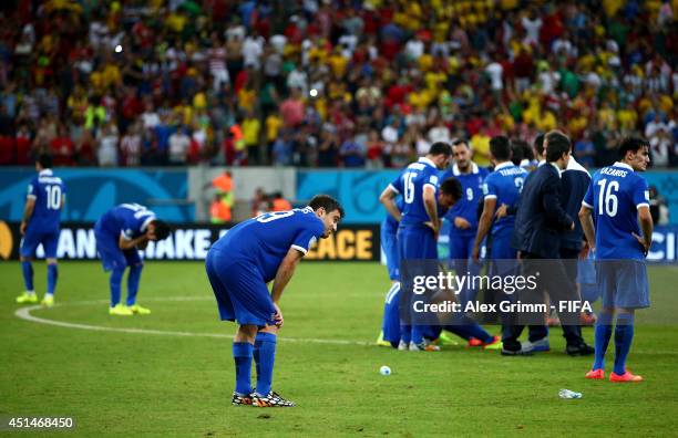 Greece players show their dejection after the defeat in the 2014 FIFA World Cup Brazil Round of 16 match between Costa Rica and Greece at Arena...