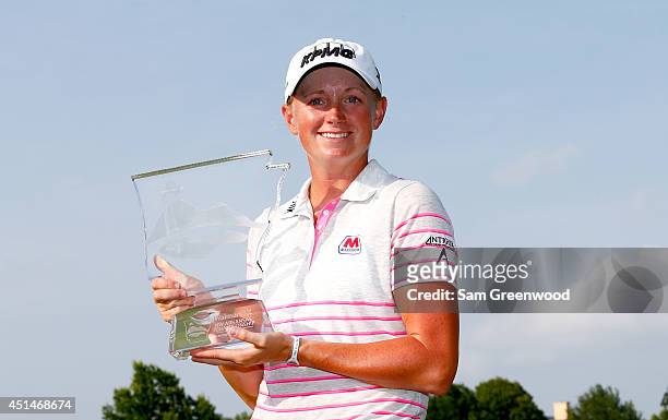 Stacy Lewis poses with the trophy after winning the Walmart NW Arkansas Championship Presented by P&G at Pinnacle Country Club on June 29, 2014 in...