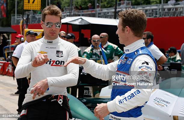 Australians Will Power , driver of the Verizon Team Penske Dallara Chevrolet chats with Ryan Briscoe, driver of the NTT Data Chip Ganassi Racing...