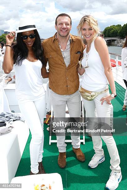 Actor Samuel Le Bihan standing between his wife and TV host Pauline Lefevre attend the 'Brunch Blanc' hosted by Barriere Group. Held on Yacht...