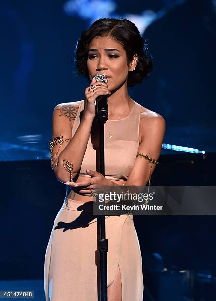 Singer Jhene Aiko performs onstage during the BET AWARDS '14 at Nokia Theatre L.A. LIVE on June 29, 2014 in Los Angeles, California.