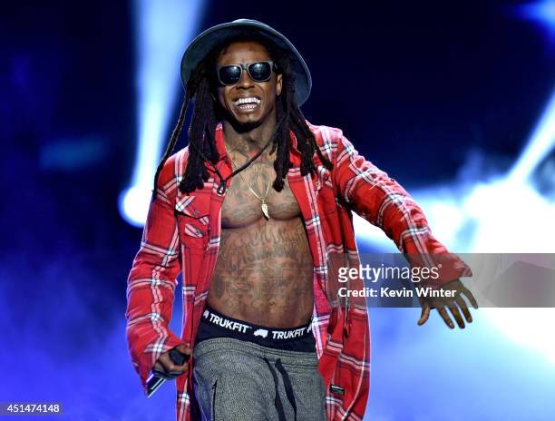 Rapper Lil Wayne performs onstage during the BET AWARDS '14 at Nokia Theatre L.A. LIVE on June 29, 2014 in Los Angeles, California.