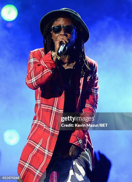 Rapper Lil Wayne performs onstage during the BET AWARDS '14 at Nokia Theatre L.A. LIVE on June 29, 2014 in Los Angeles, California.
