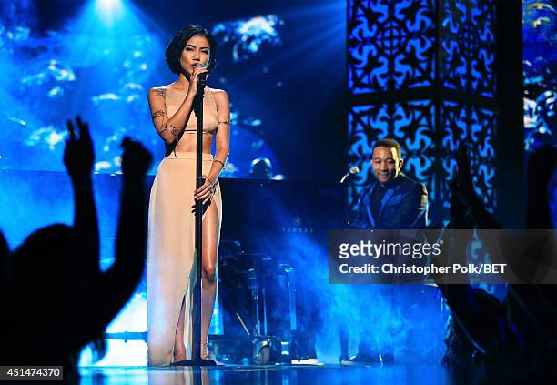 Singer Jhene Aiko and singer/songwriter John Legend perform onstage during the BET AWARDS '14 at Nokia Theatre L.A. LIVE on June 29, 2014 in Los...