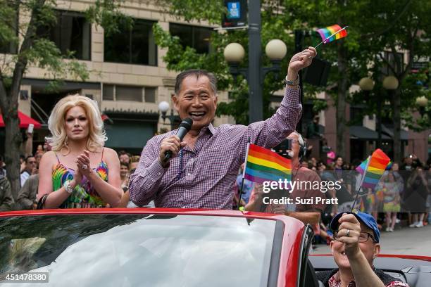 George Takei, Celebrity Grand Marshall of the 40th Annual Seattle Pride Parade, waves from a car on June 29, 2014 in Seattle, Washington.