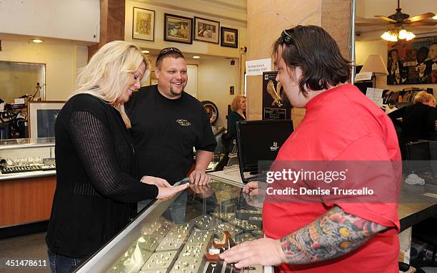 Katy Rygaard and Ax Men Gabe Rygaard purchase a ring from Pawn Stars Austin Chumlee Russell at Gold and Silver Pawn on April 7, 2010 in Las Vegas,...