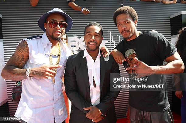 Football player DeSean Jackson, singer Omarion and actor Nick Cannon attend the BET AWARDS '14 at Nokia Theatre L.A. LIVE on June 29, 2014 in Los...