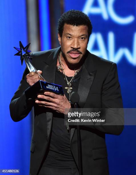 Singer Lionel Richie accepts the 2014 BET Lifetime Achievement Award onstage during the BET AWARDS '14 at Nokia Theatre L.A. LIVE on June 29, 2014 in...