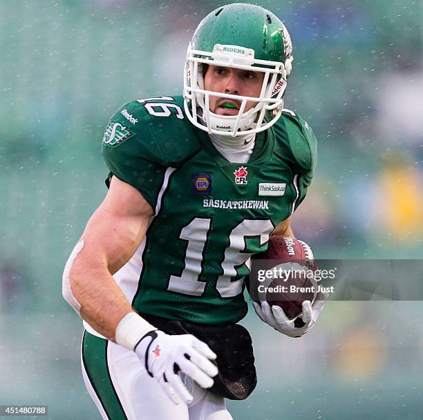 Brett Swain of the Saskatchewan Roughriders runs after a catch during week one of the 2014 CFL season at Mosaic Stadium on June 29, 2014 in Regina,...
