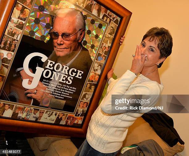 Nancy Jones pose with a plaque commemorating George jones recors sales during rehearsals for Playin' Possum! The Final No Show Tribute To George...