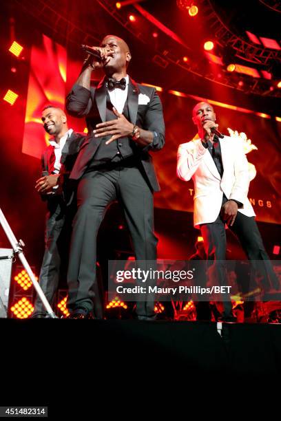 Singers Elgin Baylor Lumpkin aka Ginuwine, Tyrese Darnell Gibson aka Tyrese, and Durrell Babbs aka Tank of TGT perform onstage at the Mary J. Blige,...