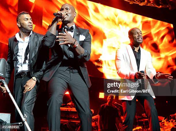 Singers Elgin Baylor Lumpkin aka Ginuwine, Tyrese Darnell Gibson aka Tyrese, and Durrell Babbs aka Tank of TGT perform onstage at the Mary J. Blige,...