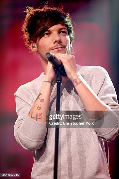 Musician Louis Tomlinson performs onstage at the "One Direction iHeartRadio Album Release Party" hosted by Ryan Seacrest at the iHeartRadio Theater...