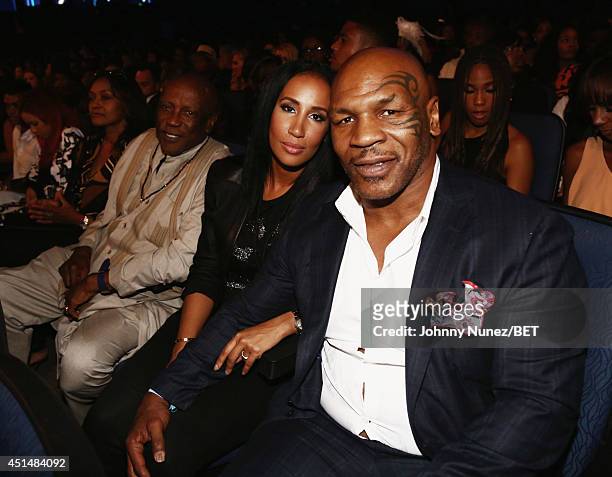 Boxer Mike Tyson and Kiki Tyson pose in the audience at the BET AWARDS '14 at Nokia Theatre L.A. LIVE on June 29, 2014 in Los Angeles, California.