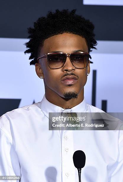 Recording artist August Alsina, winner of the Coca-Cola Viewers' Choice Award and the Best New Artist Award, poses in the Winners Room during the BET...