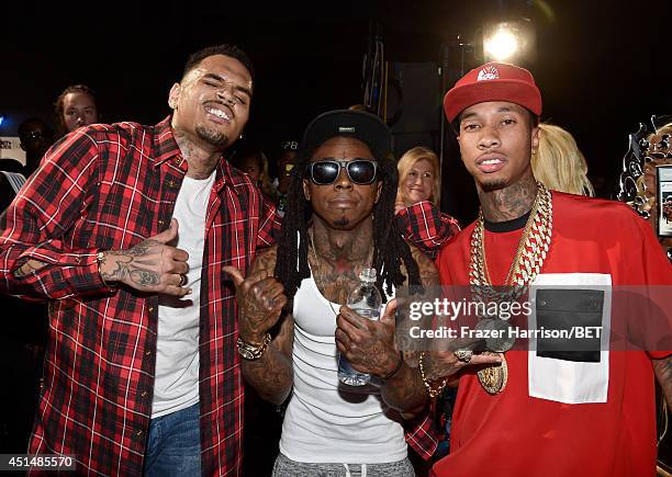 Recording artists Chris Brown, Lil Wayne, and Tyga attend the BET AWARDS '14 at Nokia Theatre L.A. LIVE on June 29, 2014 in Los Angeles, California.