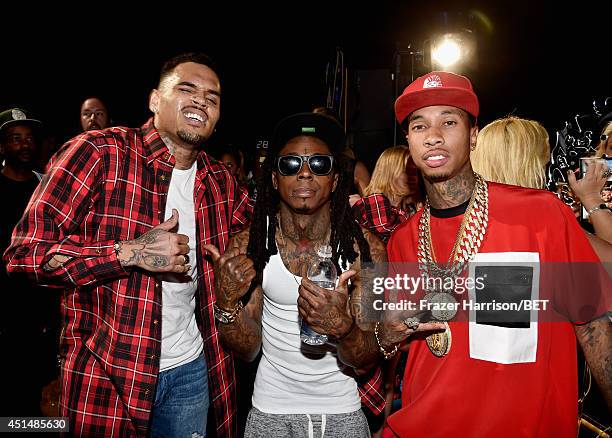 Recording artists Chris Brown, Lil Wayne, and Tyga attend the BET AWARDS '14 at Nokia Theatre L.A. LIVE on June 29, 2014 in Los Angeles, California.