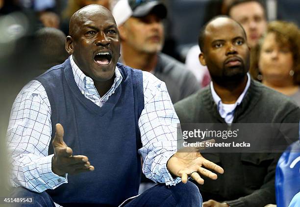Michael Jordan, owner of the Charlotte Bobcats, reacts to a call as he sits on the bench during their game against the Phoenix Suns at Time Warner...