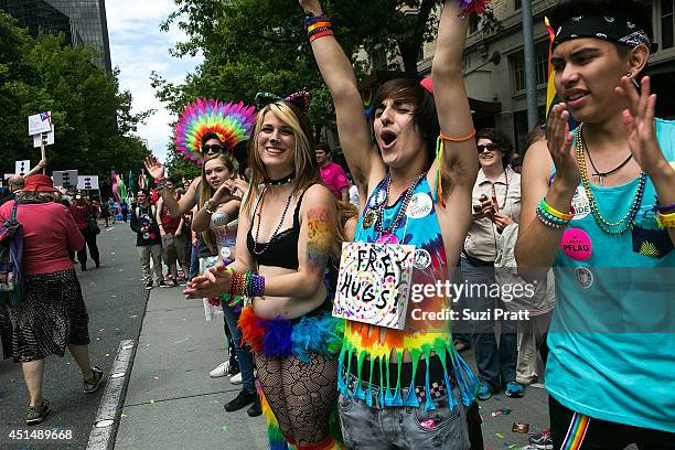 Attendees and marchers on the streets of downtown Seattle for the 40th Annual Seattle Pride Parade on June 29, 2014 in Seattle, Washington.