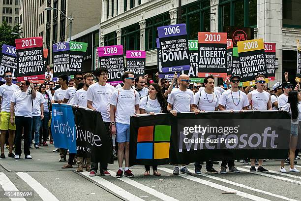 Attendees and marchers on the streets of downtown Seattle for the 40th Annual Seattle Pride Parade on June 29, 2014 in Seattle, Washington.