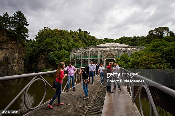 Tourists visit the Opera de Arame or the Wire Opera House, a theatre house built out of steel tubes situated in the middle of an urban green park,...