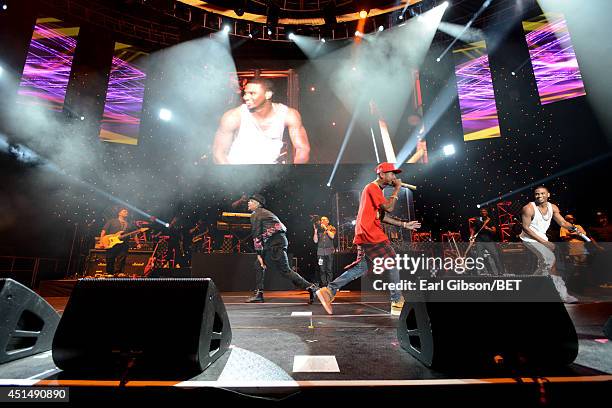 Recording artist Chris Brown, rapper Tyga, and singer Trey Songz perform onstage at the Mary J. Blige, Trey Songz And Jennifer Hudson Concert...