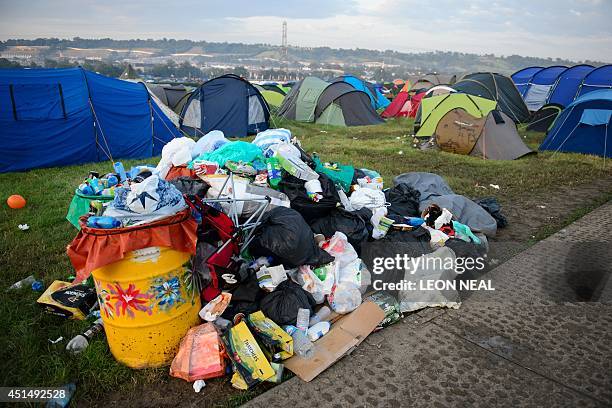 Tents, equipment and debris litter the camping fields on the morning after the Glastonbury Festival of Music and Performing Arts on Worthy Farm in...