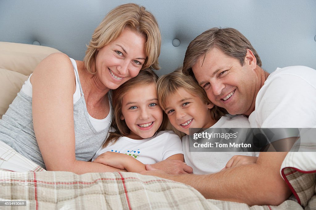 Family in bed together bonding