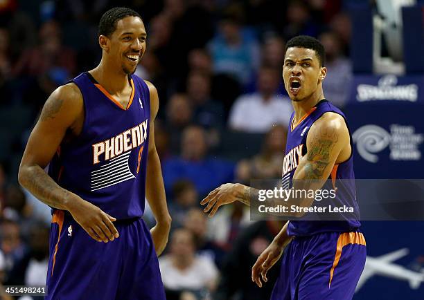 Teammates Gerald Green and Channing Frye of the Phoenix Suns react after a basket by Green during their game against the Charlotte Bobcats at Time...