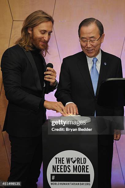 David Guetta and UN Secretary-General Ban Ki-moon on stage at the premiere of David Guetta's new music video "One Voice" onto the front of UN...