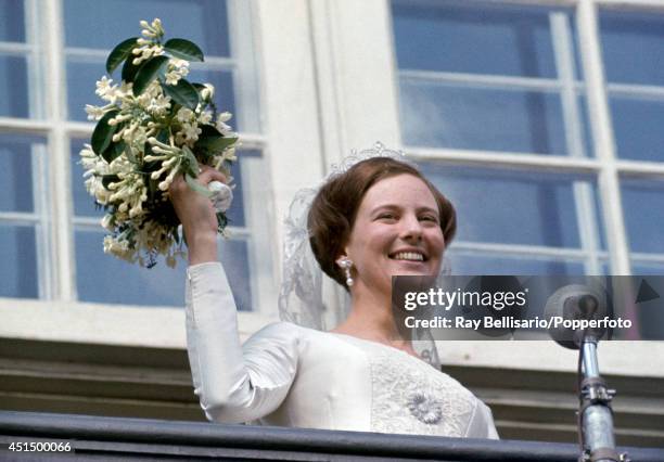 Princess Margarethe of Denmark waves to crowds on her wedding day in Copenhagen on 10th June 1967.