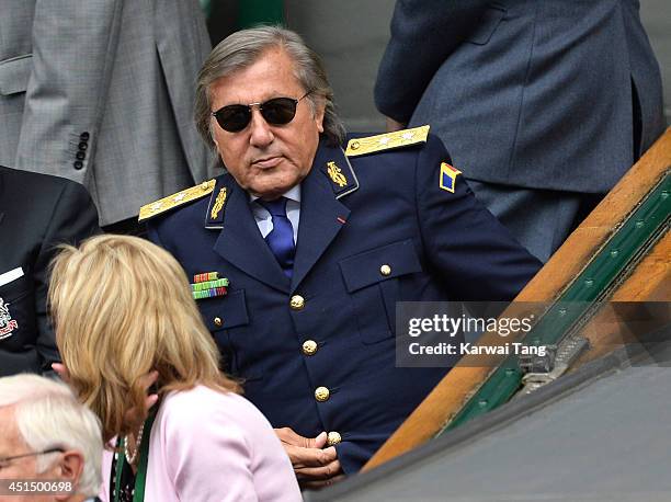 Ilie Nastase attends the Alize Cornet v Eugenie Bouchard match on centre court during day seven of the Wimbledon Championships at Wimbledon on June...