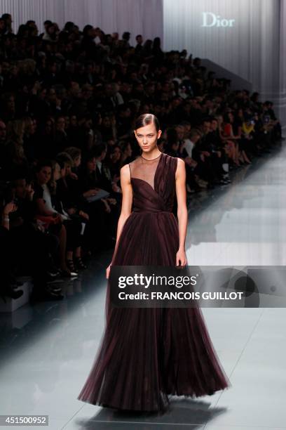 Model Karlie Kloss presents a creation by British designer Bill Gaytten for Christian Dior during the Fall/Winter 2012-2013 ready-to-wear collection...