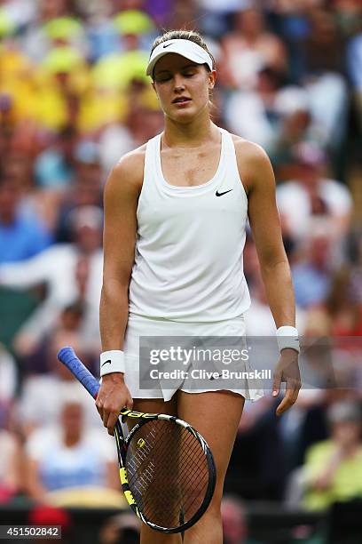 Eugenie Bouchard of Canada stands dejected during her Ladies' Singles fourth round match against Alize Cornet of France on day seven of the Wimbledon...