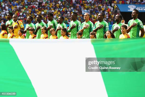 Nigeria line up for the National Anthem prior to the 2014 FIFA World Cup Brazil Round of 16 match between France and Nigeria at Estadio Nacional on...