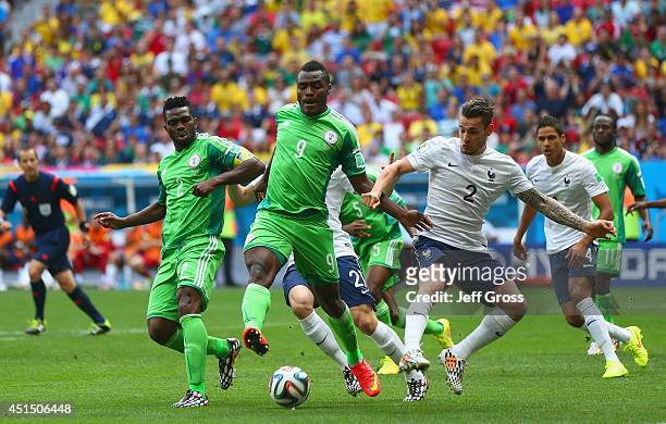 Emmanuel Emenike of Nigeria controls the ball against Mathieu Debuchy of France during the 2014 FIFA World Cup Brazil Round of 16 match between...